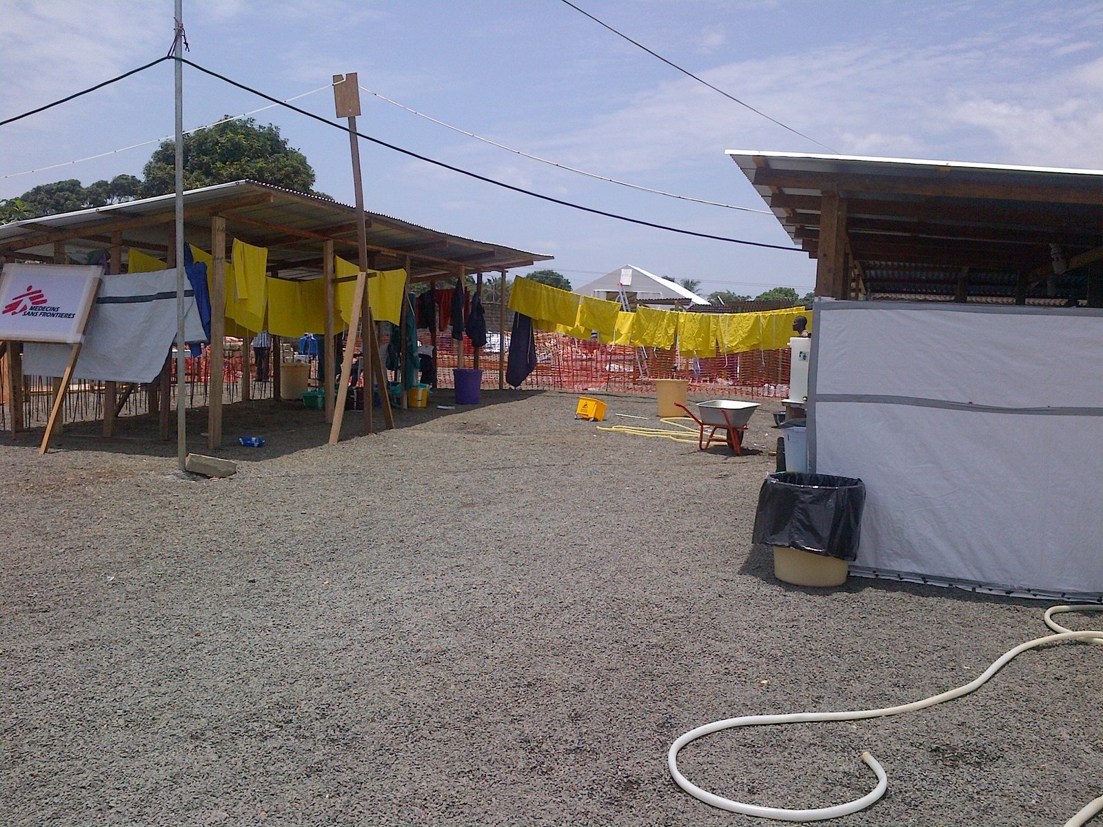 Health workers' protective gowns drying on a line at an MSF Ebola treatment unit; similar isolation facilities in Nairobi are treating Kenya's remaining Ebola patients