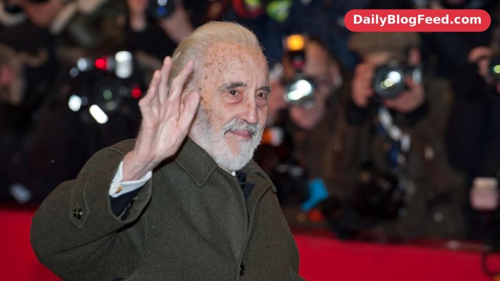 Christopher Lee waving to photographers on the red carpet at the Berlin International Film Festival in 2012