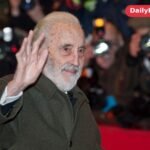 Christopher Lee waving to photographers on the red carpet at the Berlin International Film Festival in 2012