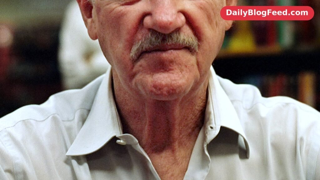 Gene Hackman smiling at a book signing in June 2008, after his retirement from acting