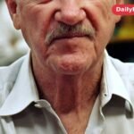 Gene Hackman smiling at a book signing in June 2008, after his retirement from acting