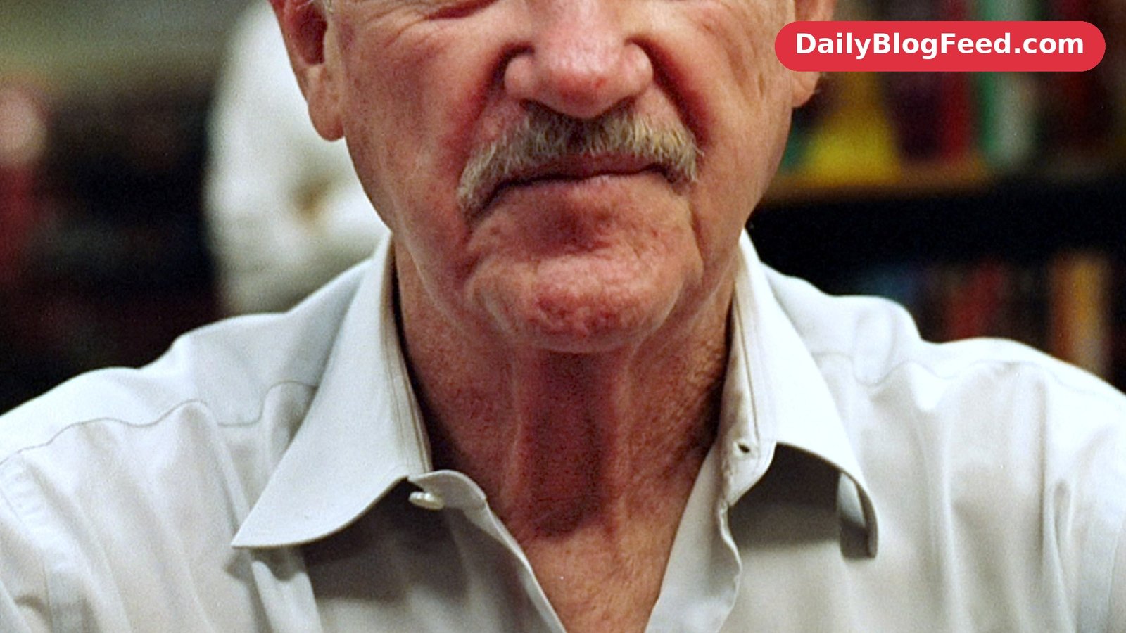 Gene Hackman smiling at a book signing in June 2008, after his retirement from acting
