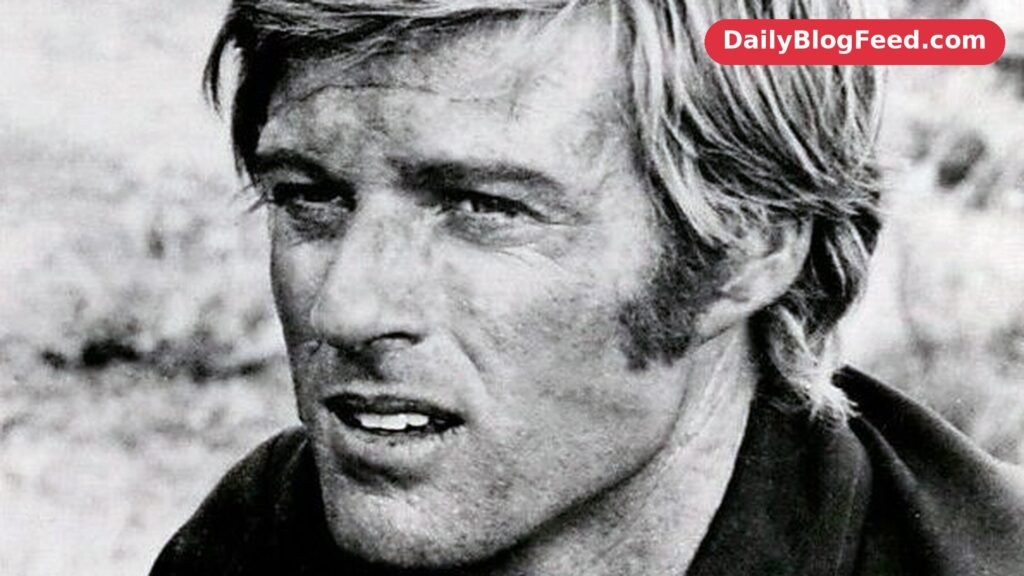 Robert Redford in a 1971 publicity portrait for Tell Them Willie Boy Is Here, looking off camera with blond hair and sideburns