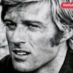 Robert Redford in a 1971 publicity portrait for Tell Them Willie Boy Is Here, looking off camera with blond hair and sideburns