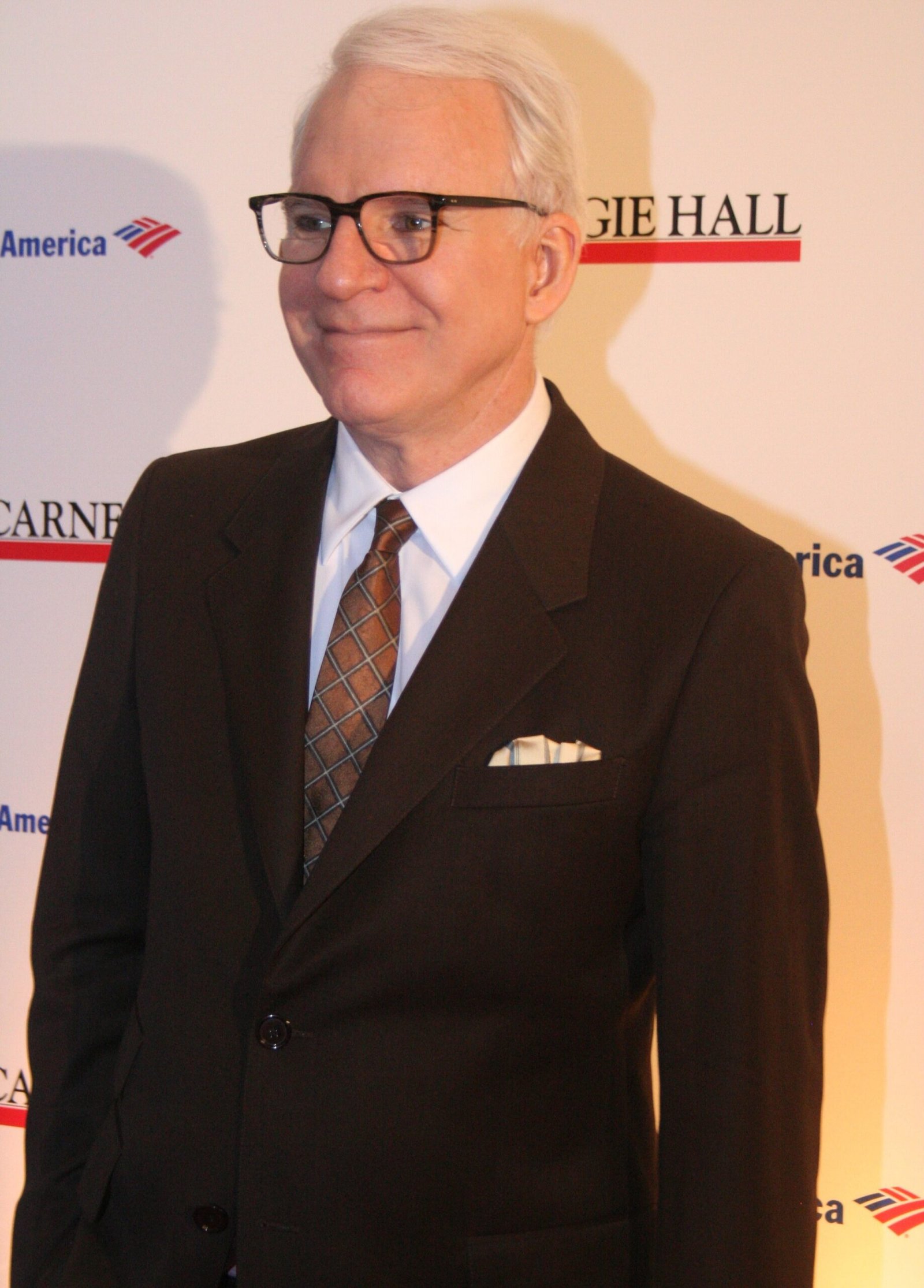 Steve Martin smiling in a dark suit at the 120th anniversary of Carnegie Hall in New York in April 2011