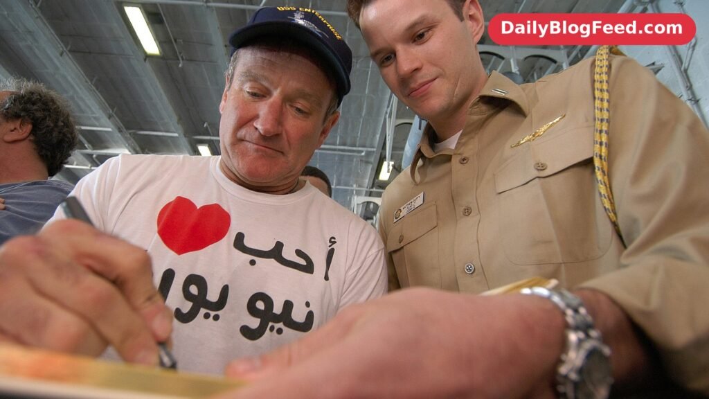 Robin Williams signing autographs for a US Navy sailor aboard the USS Enterprise in 2003