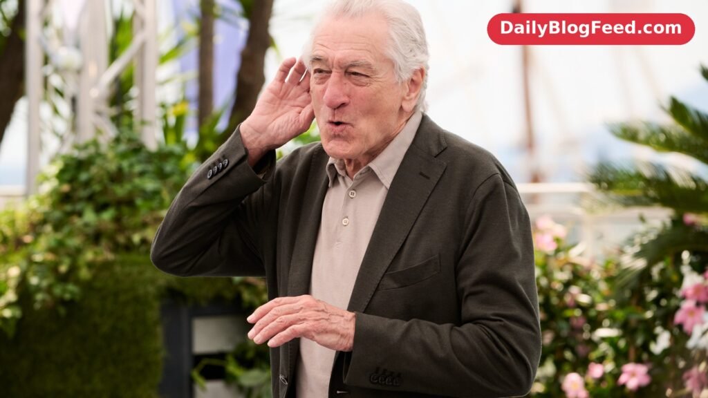 Robert De Niro smiling at a photocall during the 2025 Cannes Film Festival