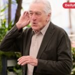 Robert De Niro smiling at a photocall during the 2025 Cannes Film Festival