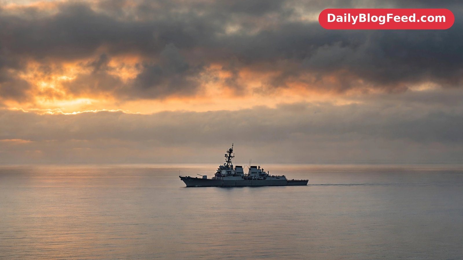 A US Navy warship patrols Gulf waters at dawn as tensions with Iran rise