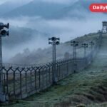 Loudspeaker towers stand along the fortified border between North and South Korea at dawn