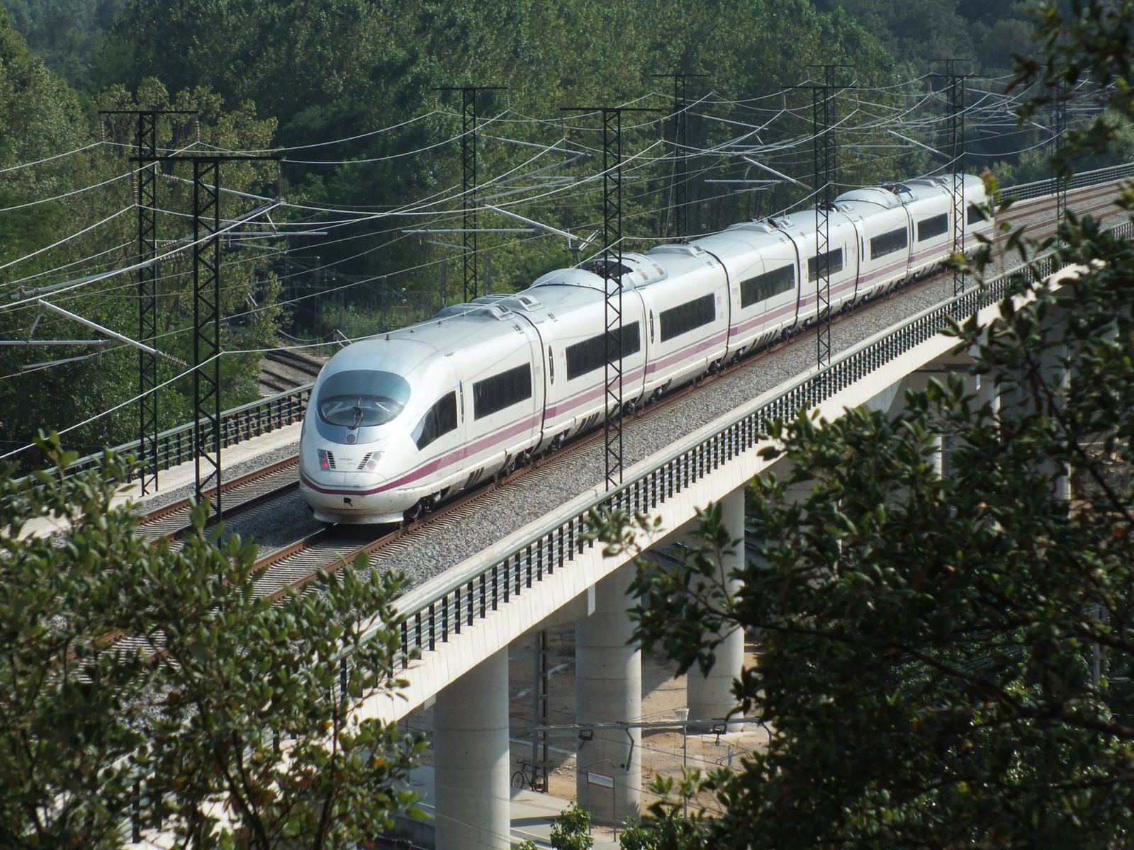 Spanish high-speed AVE train crossing a bridge